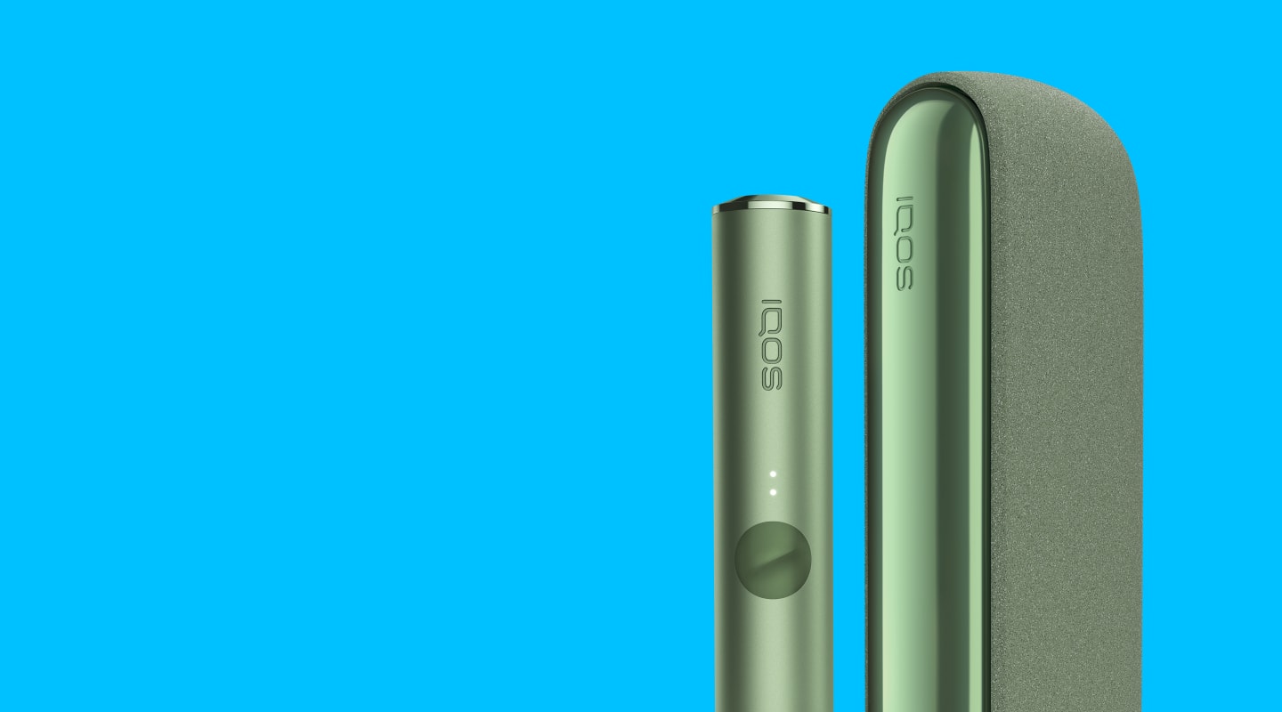 A Moss Green IQOS ILUMA device and Pocket Charger.