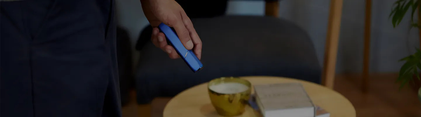 Blue IQOS 3 Multi in a man's hand