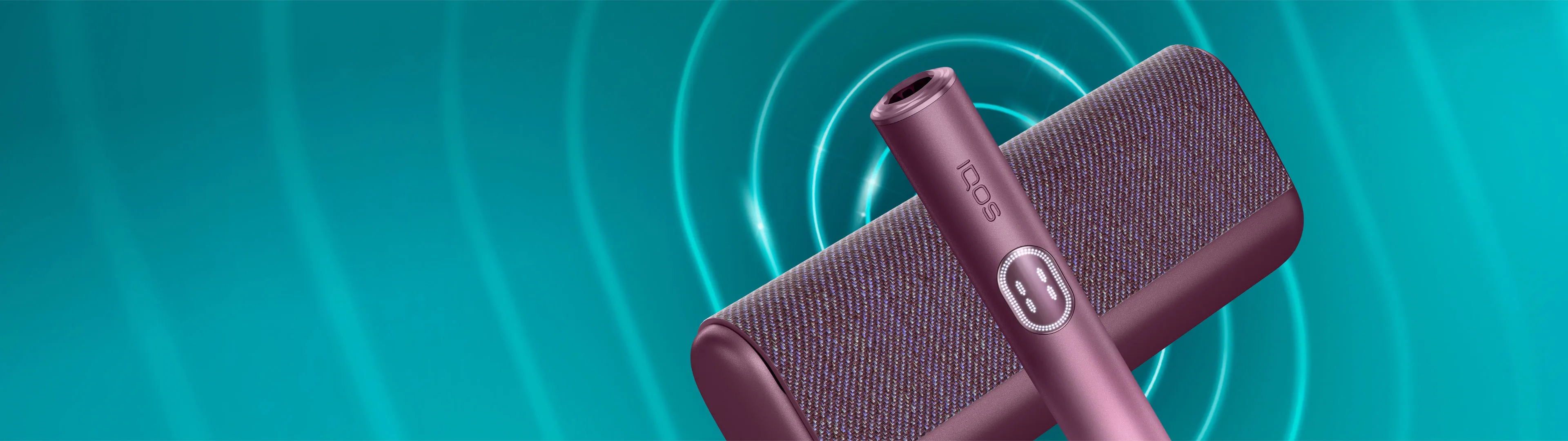 Garnet Red IQOS ILUMA i PRIME device and its charger on a dark turquoise background