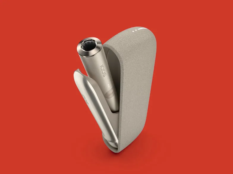An IQOS ILUMA Holder and Pocket Charger. 